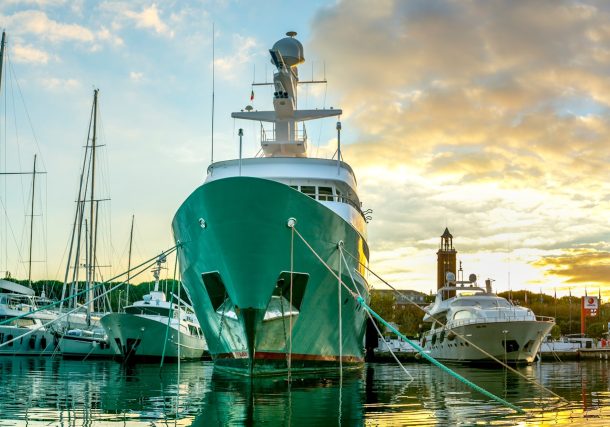 white and green boat on water during daytime