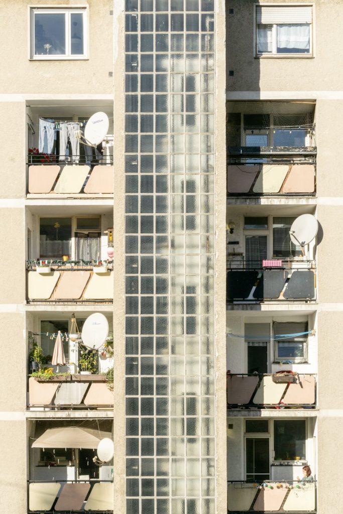 A tall building with balconies and balconies on the balconies