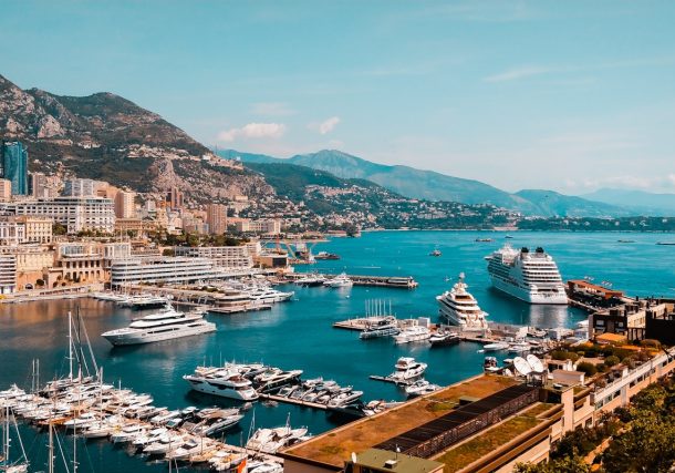 white and blue boat on sea during daytime