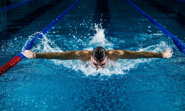 man doing butterfly stroke