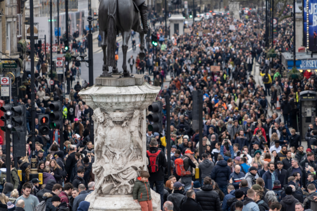 London Safety Today: How Global Events and Terrorism Threat Levels Affect Visitors Large crowd gathered in central London near Trafalgar Square, illustrating public gatherings, protest activity and security awareness in the city.