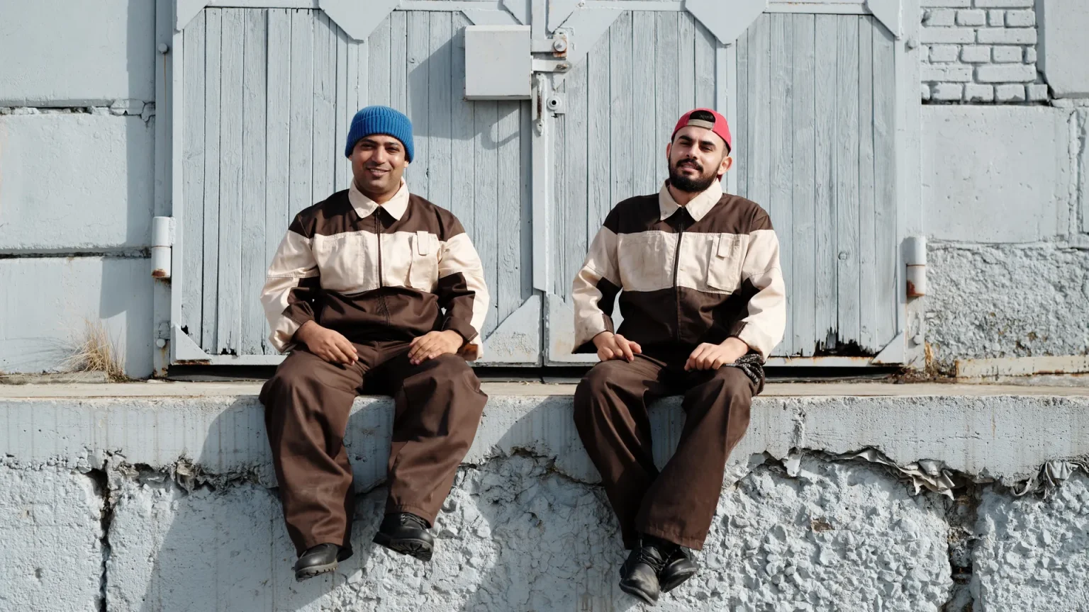 Workers in team uniforms on site