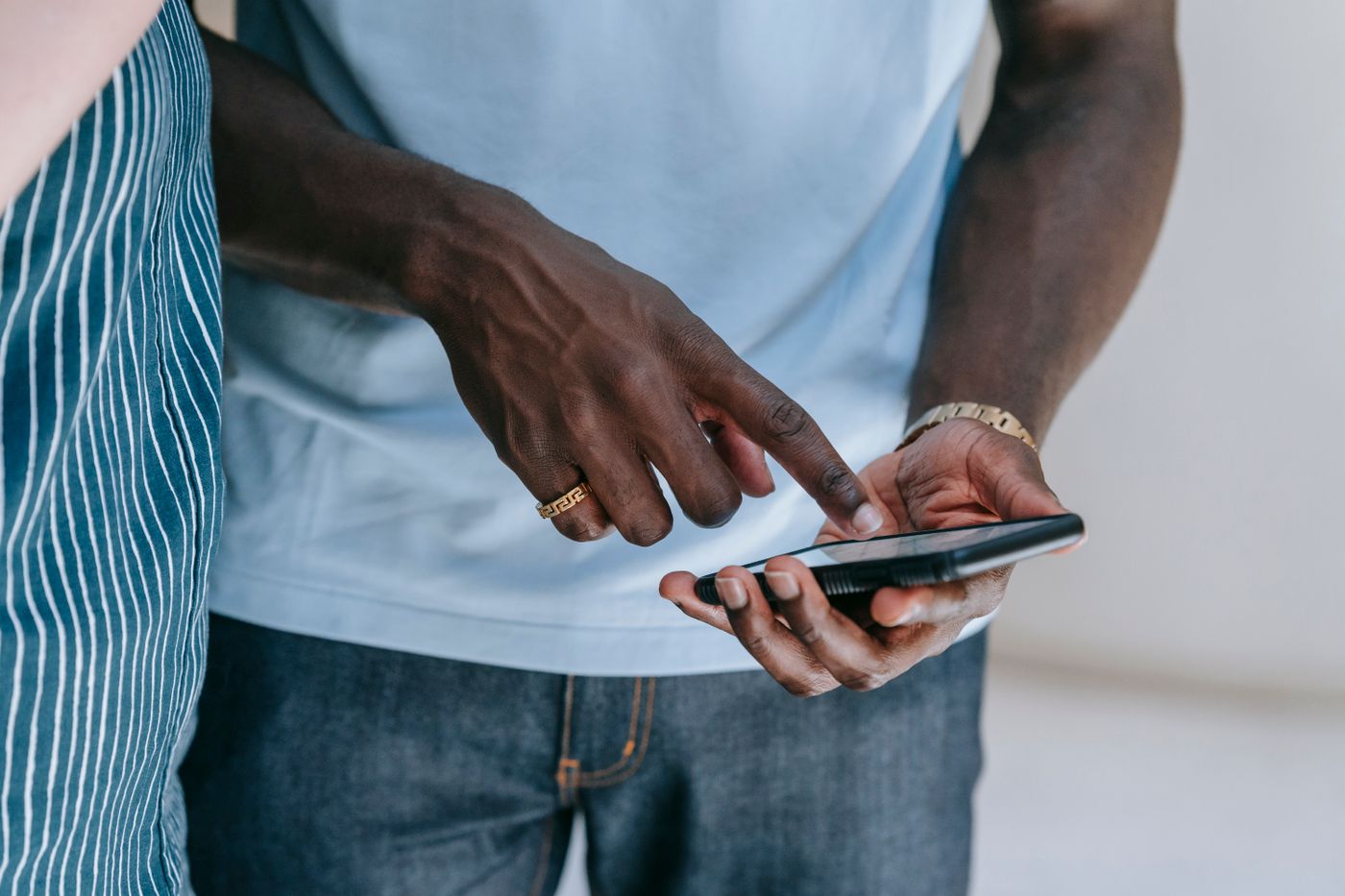 Hands using a smartphone to browse social media