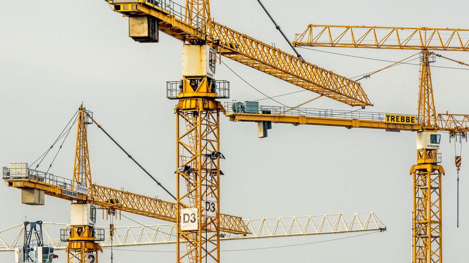Construction new orders jump 16.2 per cent to £83.3 billion as private housing falls Cranes above a building site under construction in a UK city