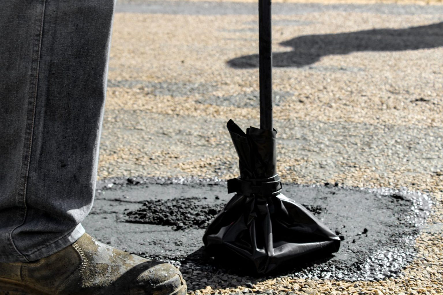 Solomon Asamoah on Ghana’s Maintenance Gap and Why Building Infrastructure Is Only the Beginning A worker patching a pothole during road maintenance