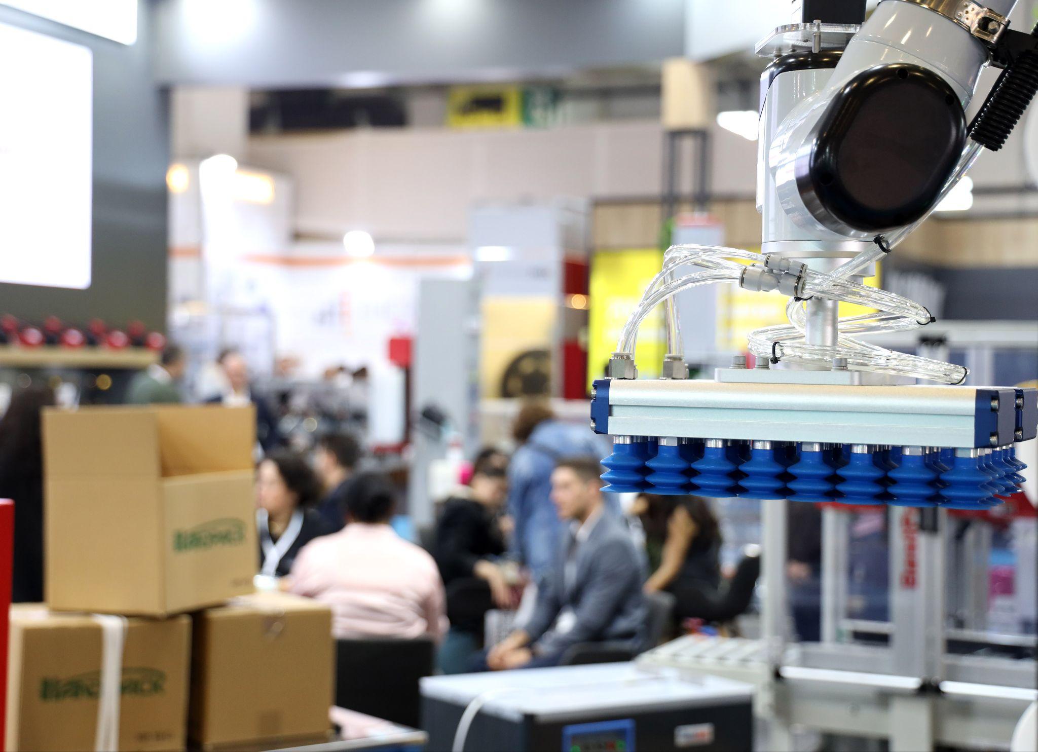 Istanbul hosts the 31st Eurasia Packaging fair in October 2026: a robotic vacuum gripper lifting cartons on an exhibitor stand at Eurasia Packaging Istanbul