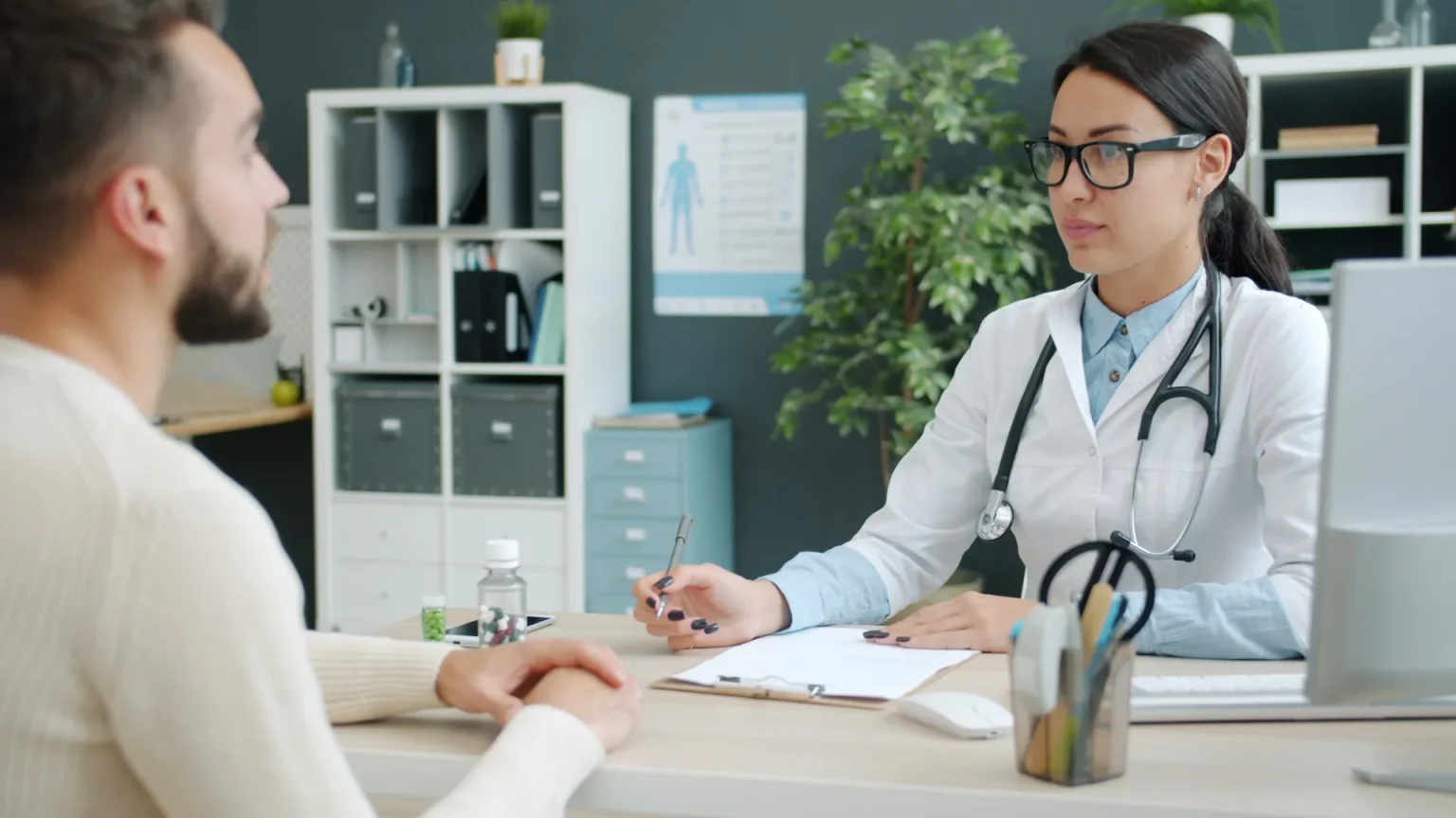 A GP consulting with a patient in a surgery