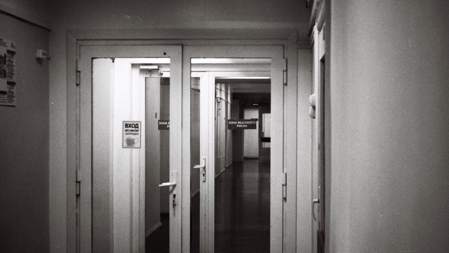 An empty hospital corridor with soft lighting