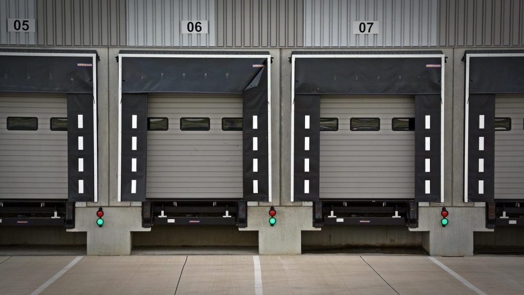Warehouse loading bays with closed roller shutter doors